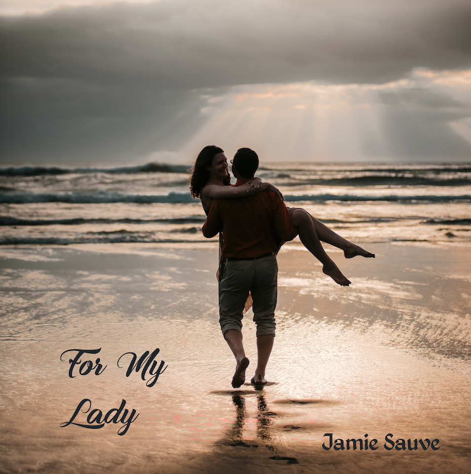 The album cover of For My Lady by Jamie Sauve: Jamie carrying his wife Ariana down a beach toward the ocean with sunbeams in the background.
